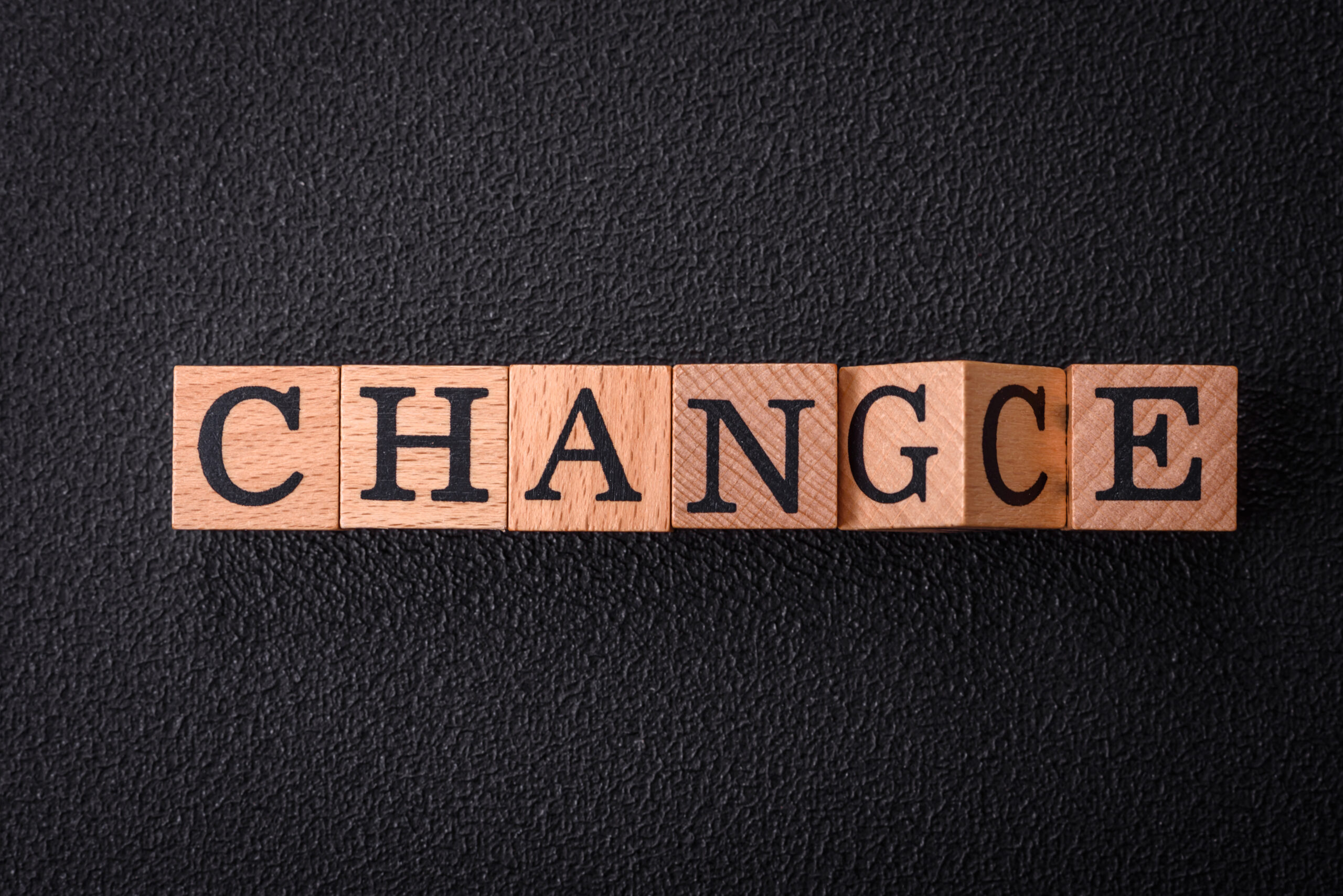 Blocks spelling 'change' with the 'g' being replaced to form 'chance,' symbolizing the fear of change and the opportunity it brings in recovery