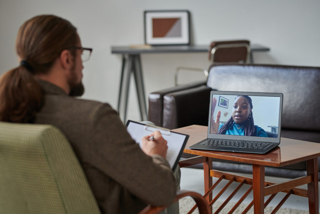Inneractions clinician leading a HIPAA-compliant virtual IOP session for clients in California and Oklahoma