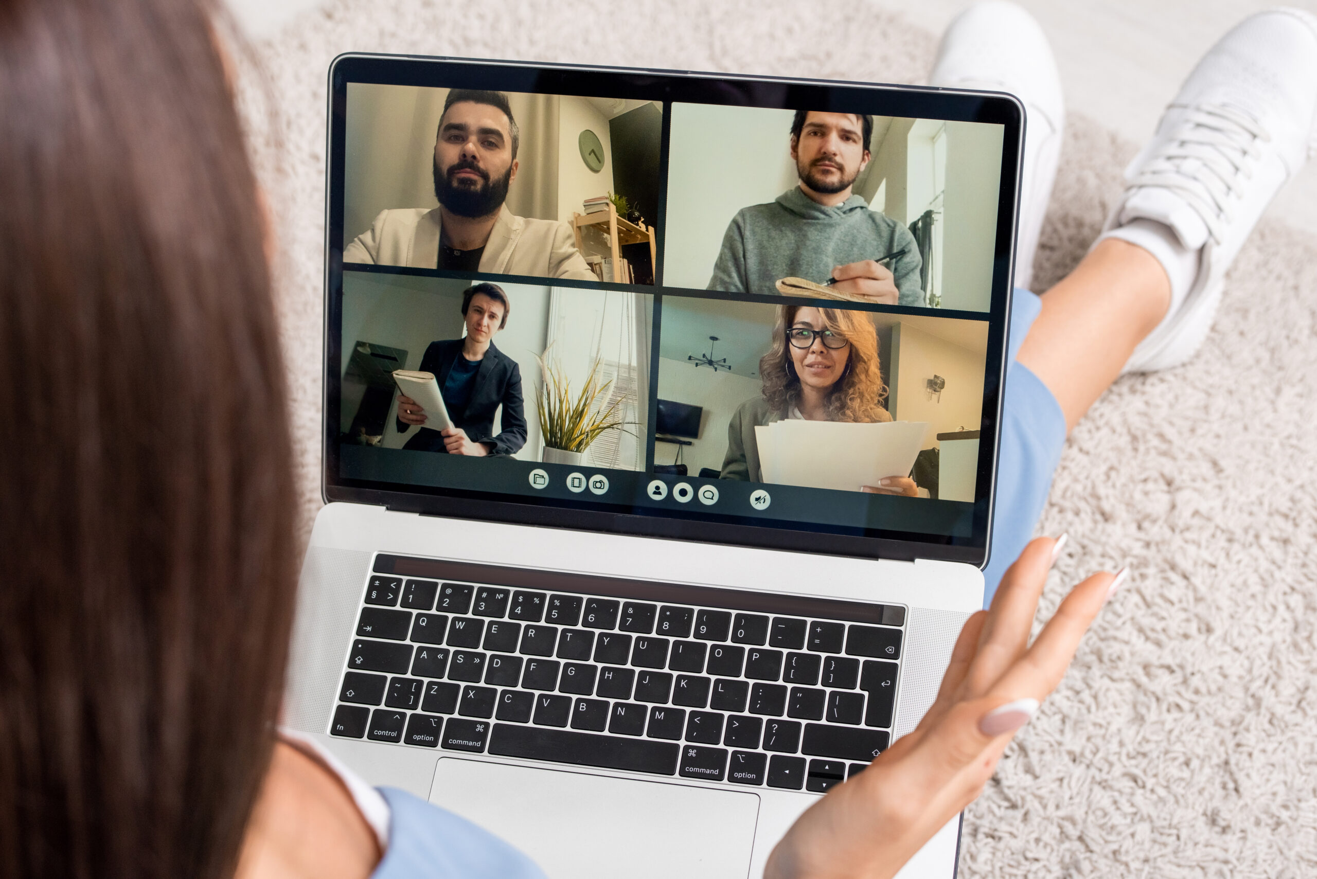 Woman attending a virtual IOP group session from home in California