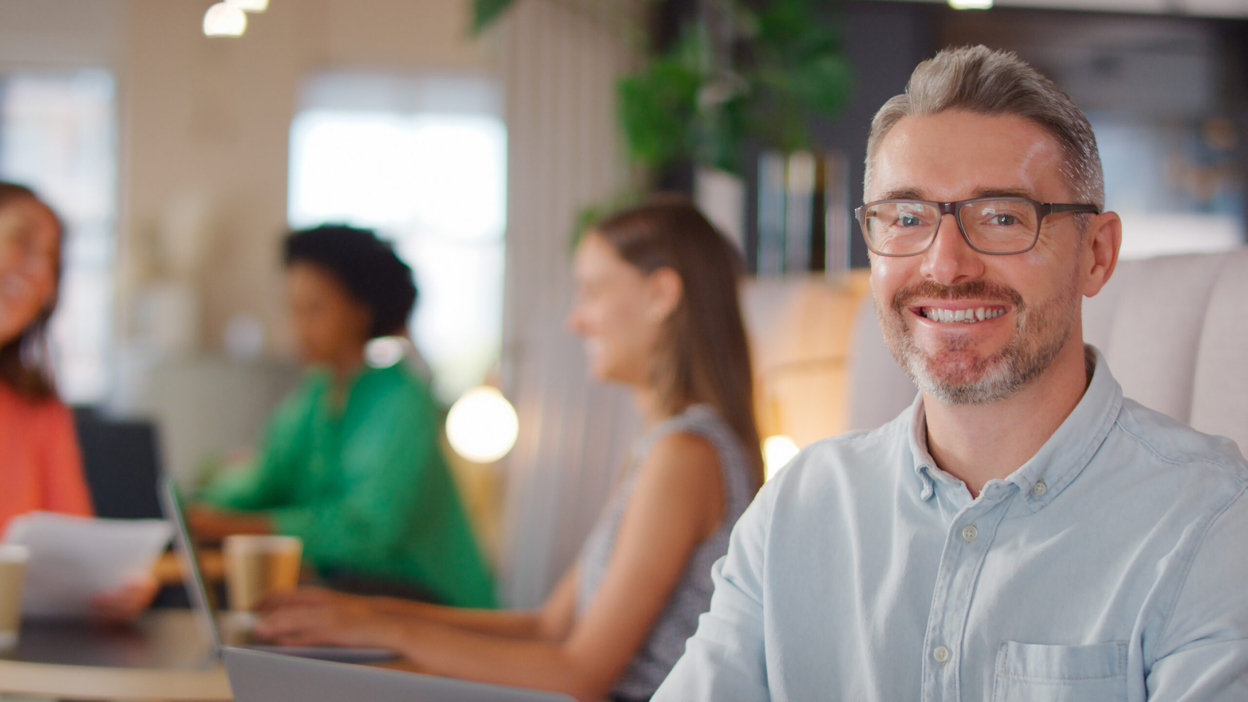 person masking smiling depression behind a cheerful exterior at work