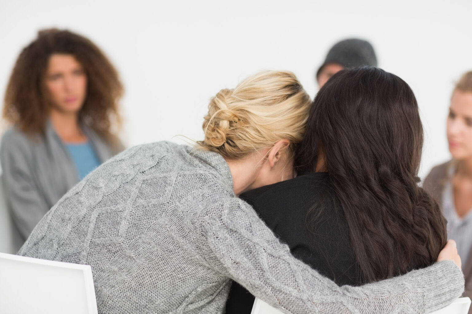 support group helping someone cope with survivor's guilt